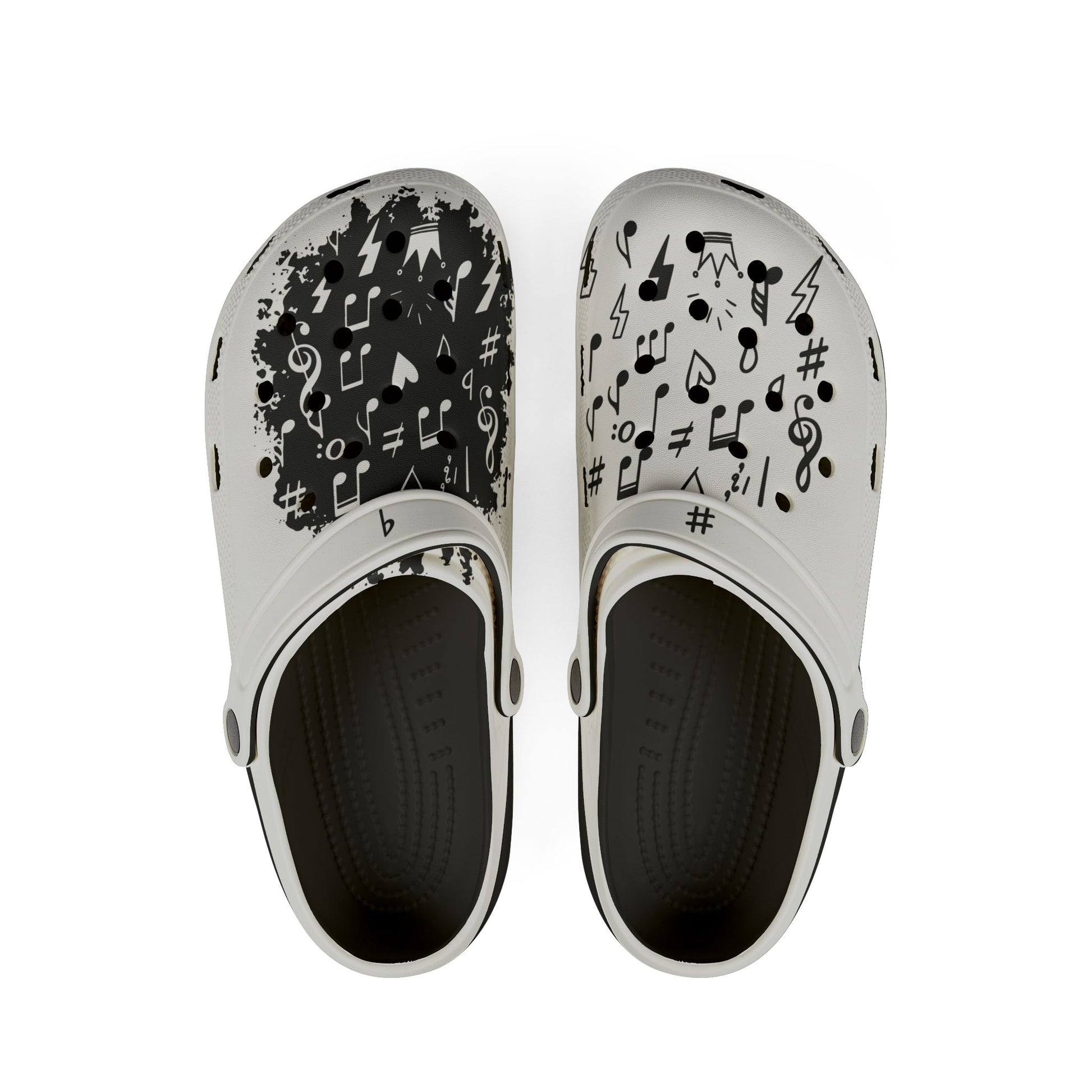 Black-and-white EVA music clogs with black footbeds and contrasting musical note and treble clef artwork.