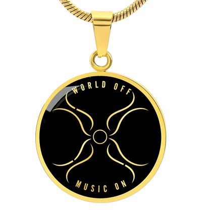 Gold circle pendant necklace with black face, abstract gold symbol, and World Off Music On text