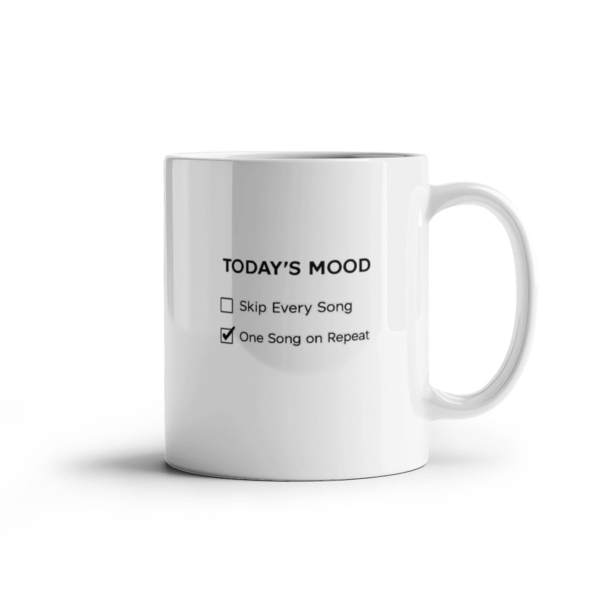 White ceramic coffee mug featuring “Today’s Mood” with “One Song on Repeat” checked and “Ask Me Again Tomorrow” printed on the opposite side.