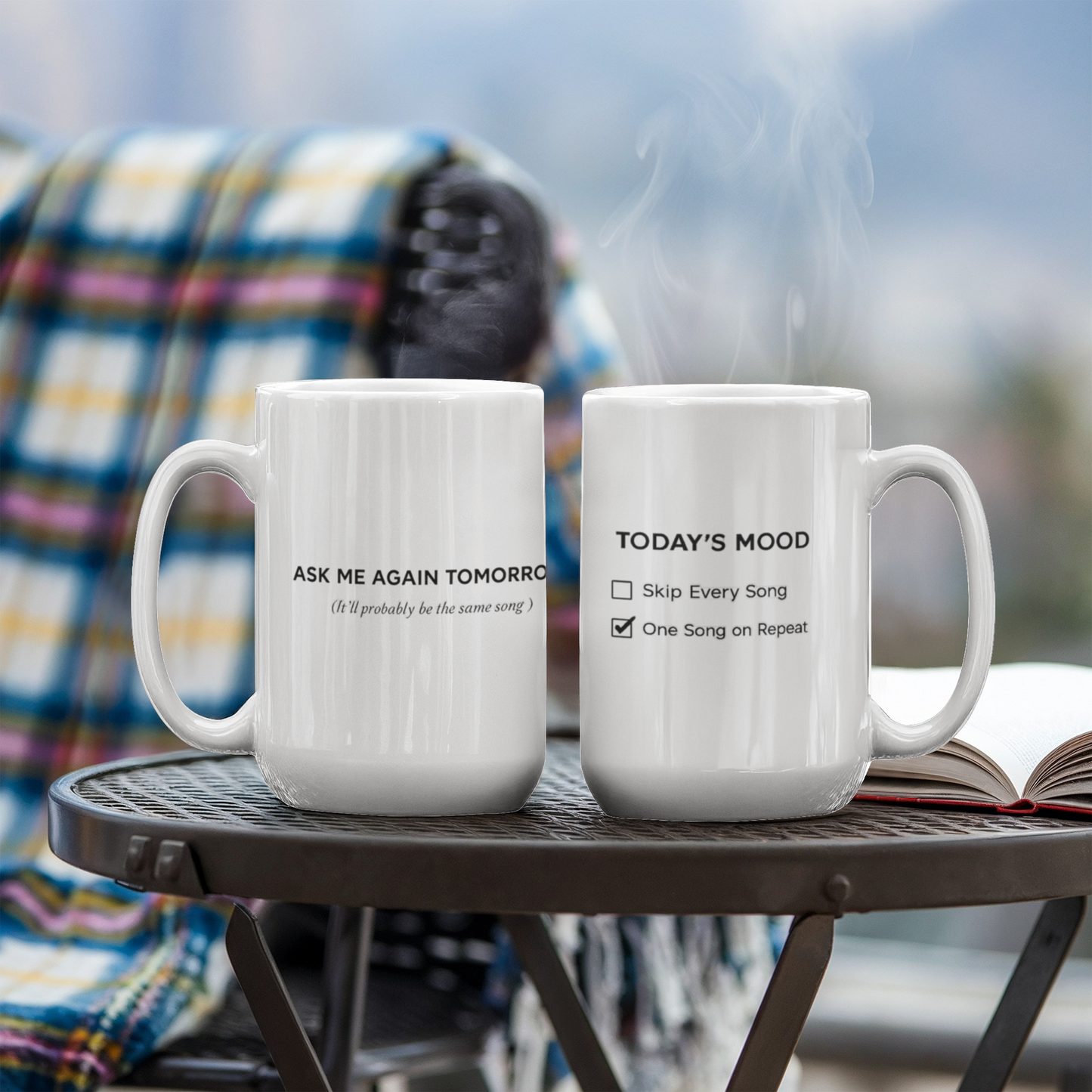 Reverse side of a white mug reading “Ask Me Again Tomorrow. It’ll Probably Be the Same Song.”