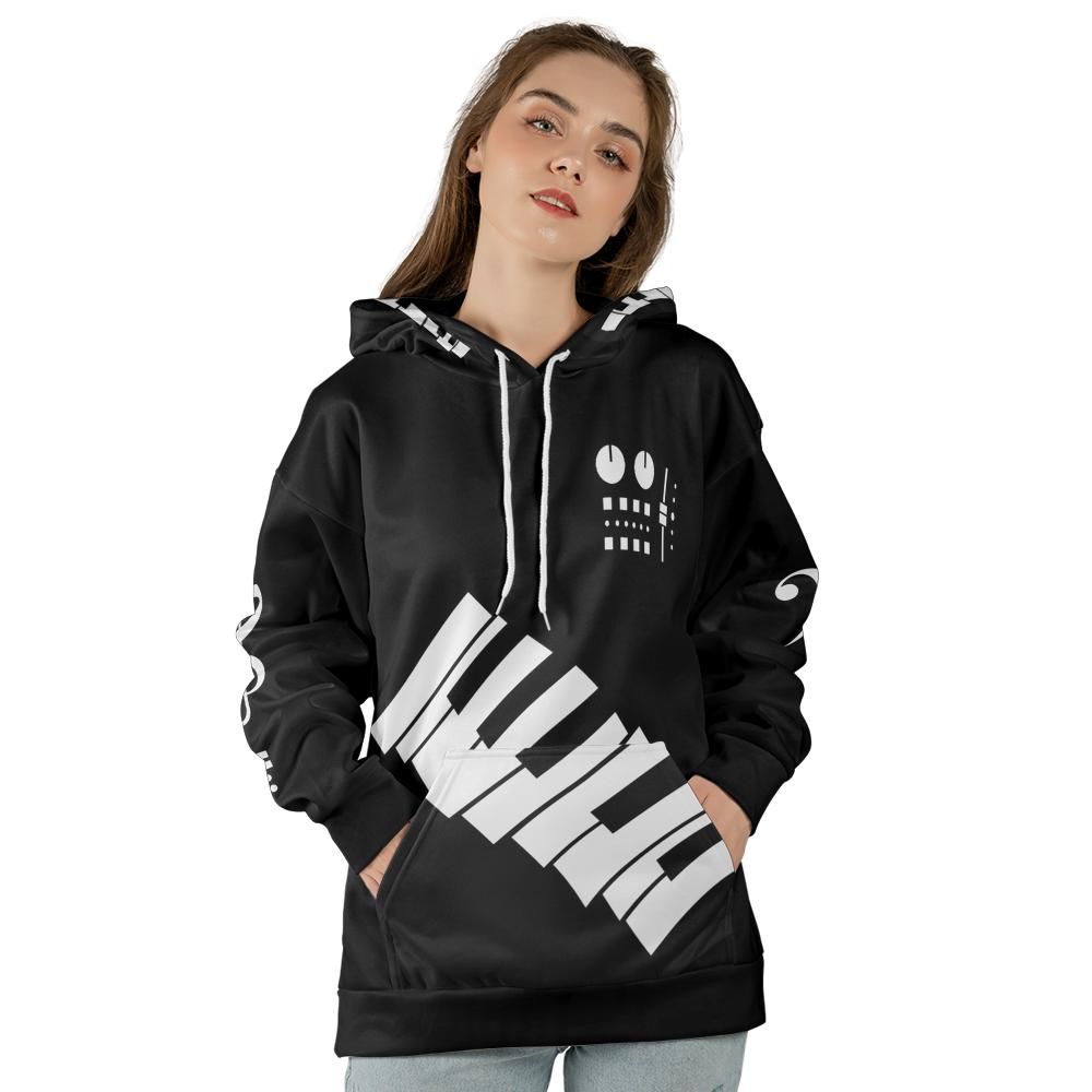 Black all-over-print music hoodie with diagonal white piano keys, synth-control graphic and white musical symbols